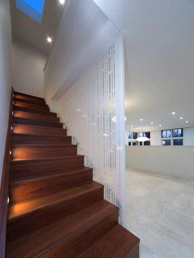 timber stairs with white painted walls